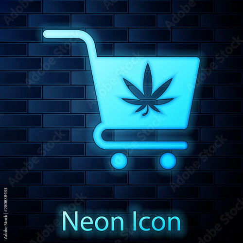 Glowing neon Shopping cart with marijuana or cannabis leaf icon isolated on brick wall background. Online buying. Delivery service. Supermarket basket. Vector Illustration