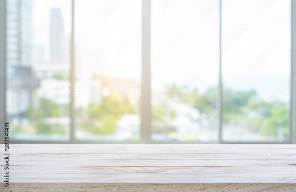 Wood table top on blur window glass,wall background with city view - obrazy, fototapety, plakaty 