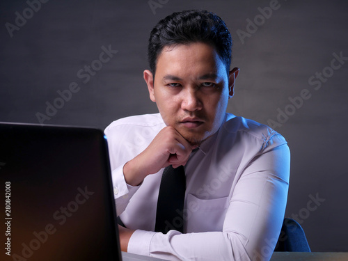 Quadro em tela Male Businessman Looking at Camera with Cynical Look