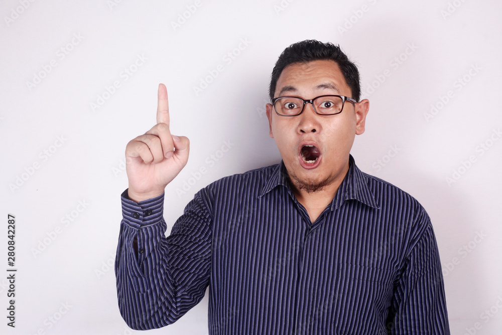 Young Man Thinking and Looking Up, Having Good Idea, with Mouth Open Young Man Thinking and Looking Up, Having Good Idea, with Mouth Open