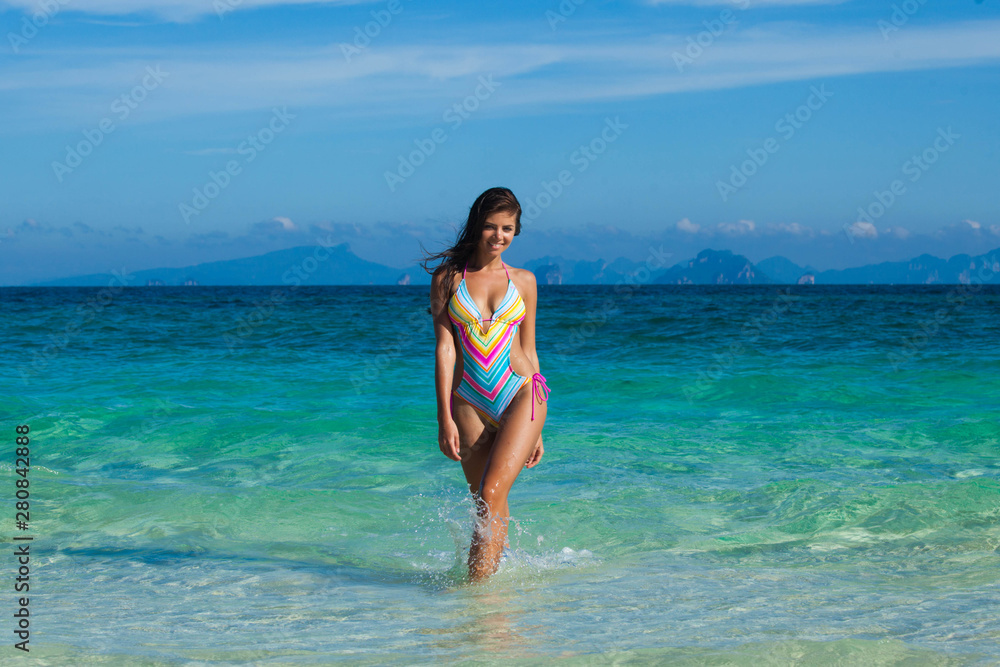 Woman in bikini at seaside