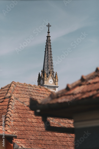 Rural scene from a village in Romania  street  houses and a church tower in the background