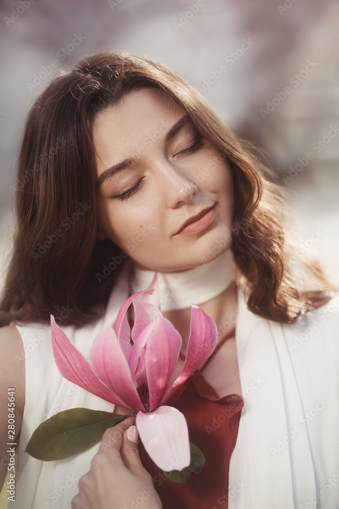Naklejka premium Woman with Flowers Outdoors