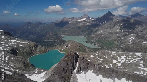 Flight over Weissee and Tauernmoosee alpine lakes in Uttendorf, Salzburger Land, Austria. photo