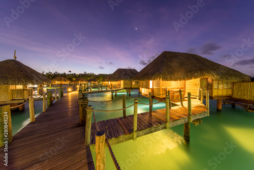 Fototapeta Naklejka Na Ścianę i Meble -  Overwater bungalows at night, Bora Bora, French Polynesia