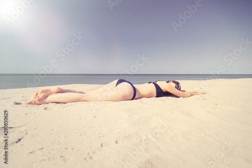 beautiful girl sunbathes © tugolukof