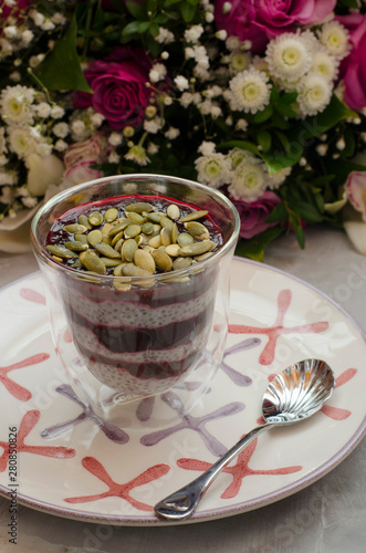 Chia Pudding on Milk with Black Currant and Bouquet