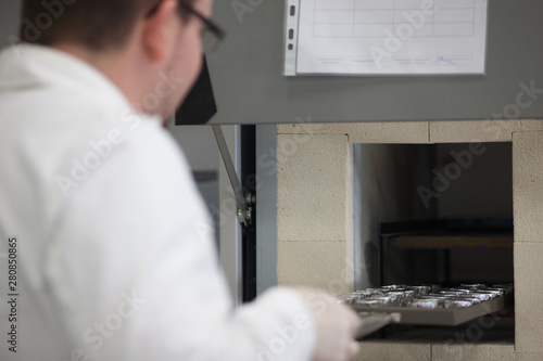Slika na platnu Preparation of samples under fume cabinets in order to analyse them in an Analyt