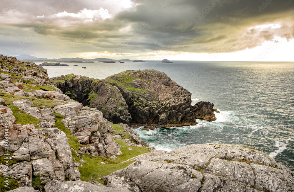 lush west coast of isle of Lewis, outer Hebrides in Scotland with dramatic cloudy sky