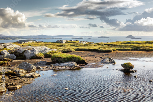 lush west coast of isle of Lewis, outer Hebrides in Scotland with dramatic cloudy sky photo