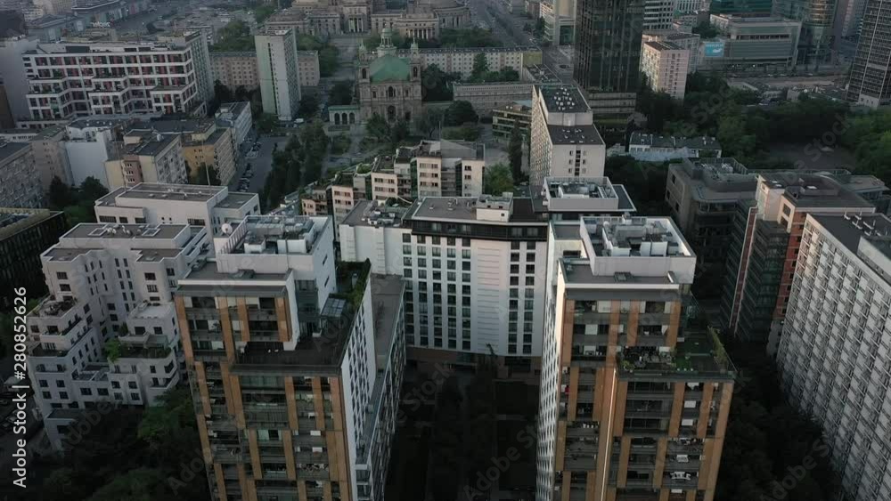 Aerial view of Warsaw at sunrise. Modern skyscrapers and old buildings in sunny weather. Top view of the skyscrapers of Warsaw. Drone Shot 4K. Aerial view of Warsaw at sunrise. Modern skyscrapers and old buildings in sunny weather. Top view of the skyscrapers of Warsaw. Drone Shot 4K.