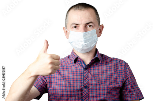 Man showing okay gesture. Photo of healthy man wears protective mask against infectious diseases and flu. Health care concept