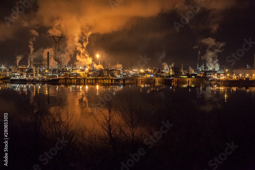night view of a petrochemical plant on the banks of the Seine River