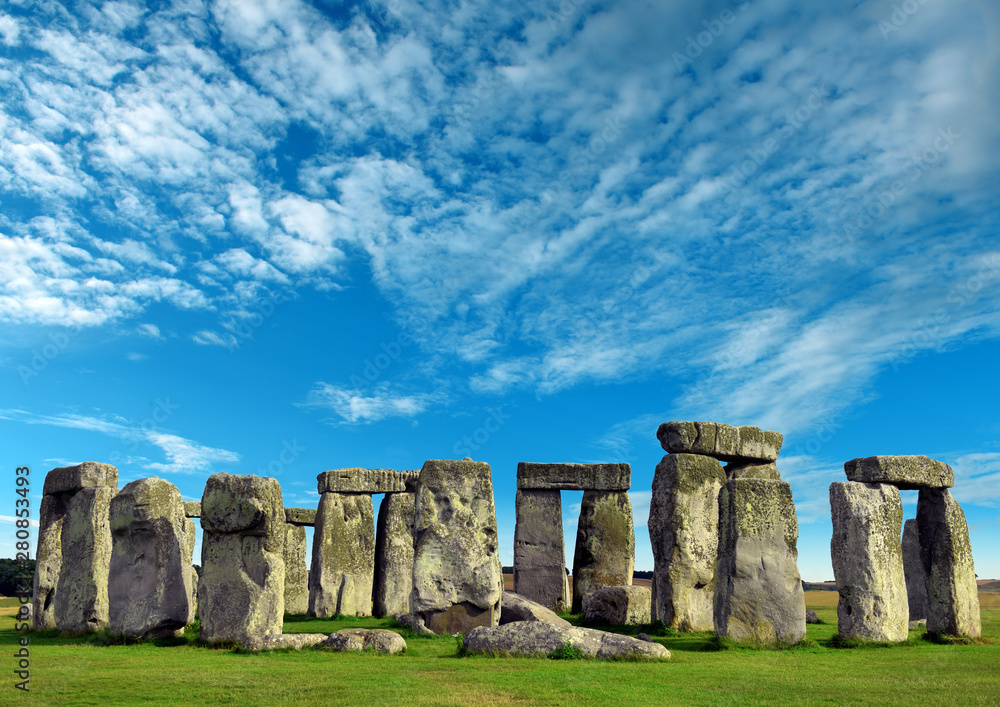 Naklejka premium Stonehenge an ancient prehistoric stone monument from Bronze and Neolithic ages, constructed as a ring near Salisbury with dramatic sky, Wiltshire in England, United Kingdom