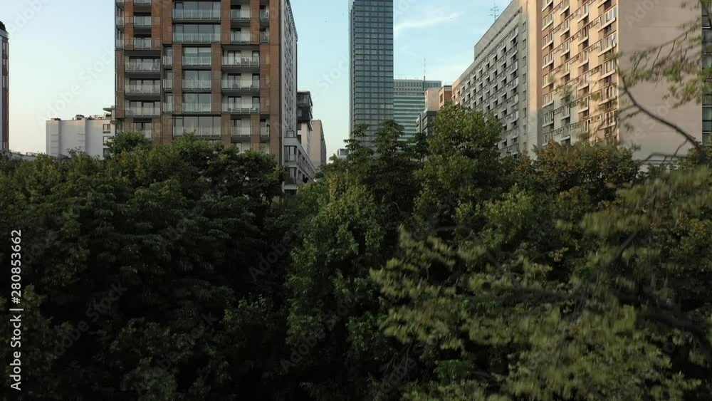 Warsaw Poland. Aerial view of the towers and buildings in the city center. Sunrise in the summer. The sun's rays are reflected in modern skyscrapers. Drone Shote 4K Warsaw Poland. Aerial view of the towers and buildings in the city center. Sunrise in the summer. The sun's rays are reflected in modern skyscrapers. Drone Shote 4K