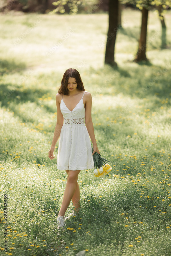 Woman with Bouquet of the Spring Flowers Outdoors Woman with Bouquet of the Spring Flowers Outdoors
