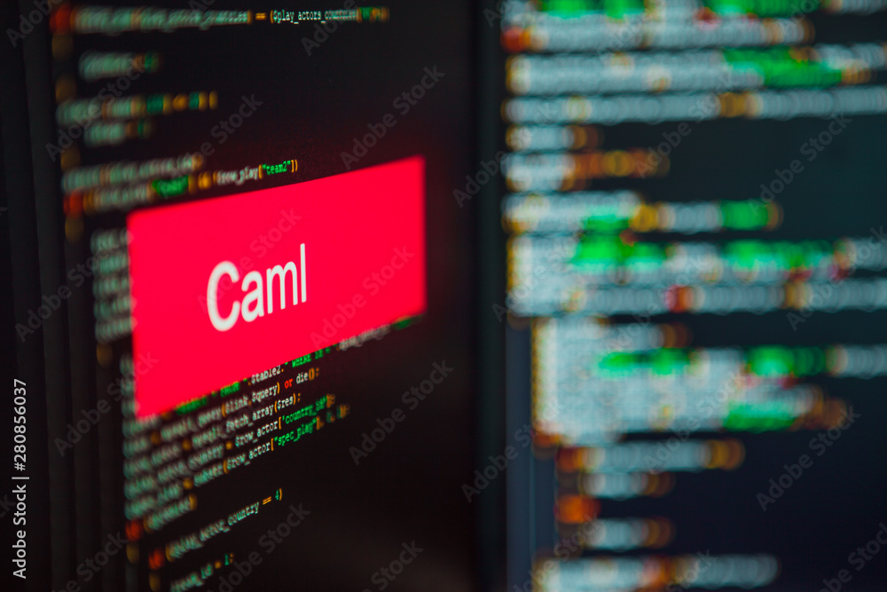 Programming language, Objective Caml inscription on the background of computer code. Programming language, Objective Caml inscription on the background of computer code.