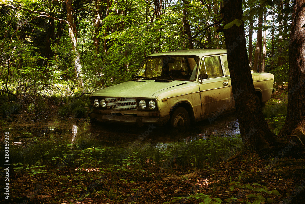 An old Russian car Vaz 2106 in the deep forest An old Russian car Vaz 2106 in the deep forest