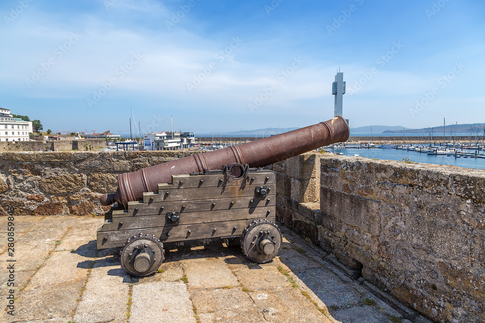 La Coruna, Spain. Medieval cannon on the wall of the castle of San Anton