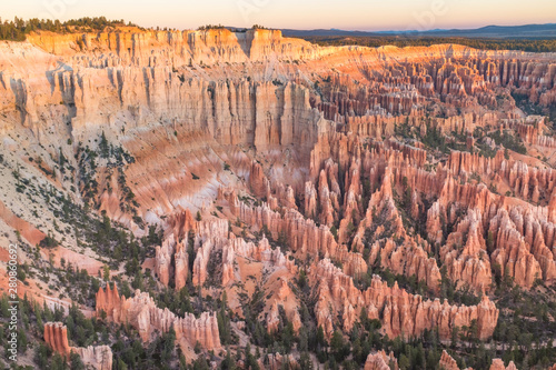 The stunning Bryce Canyon bowl in all its glory at sunrise, amazing limestone hoodoo with various shades of oranges and reds.