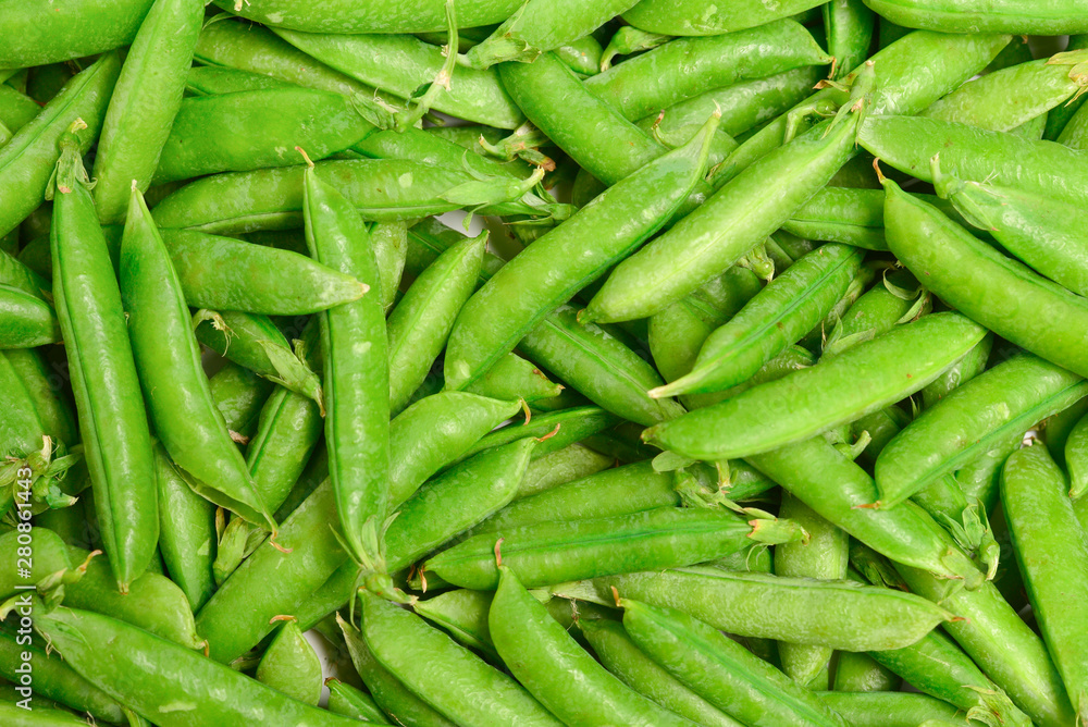 Fresh pea pods as background. Top view. Fresh pea pods as background. Top view.