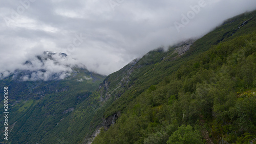The top part of the famous road Trollstigen in Norway  with beautiful clouds in the background with amazing mountains. July 2019