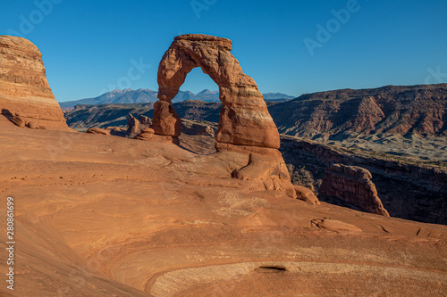 A landscape shot of the beautiful Delicate Arch at dusk at Arches National Park