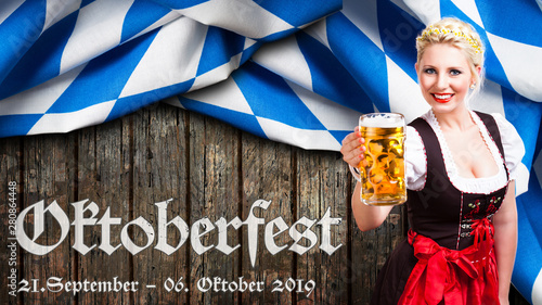 Oktoberfest 2019 Banner mit junger Frau im Dirndl vor Holzhintergrund photo