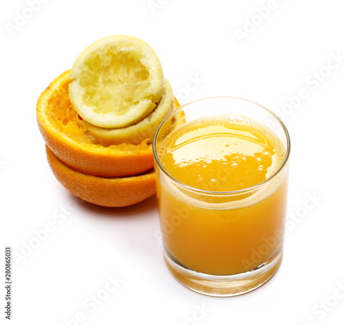 Organic mix juice in glass with peel lemon and orange isolated on white, top view