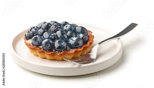 blueberry tart on white plate