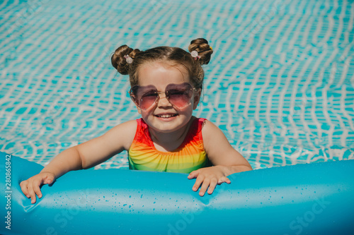 Portrait of babygirl in swimming pool.