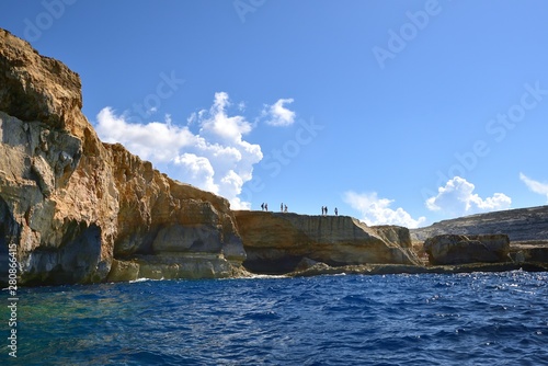 Toursits on the Gozo cliffs