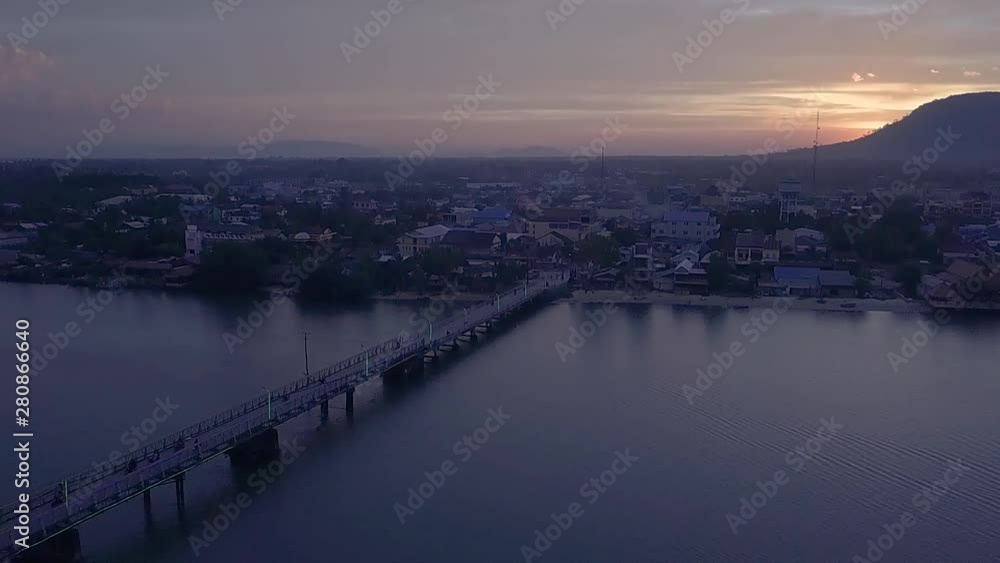 Aerial Shot of the Entanou Bridge and mountains on the Praek Tuek Chhu River in Kampot, Cambodia.