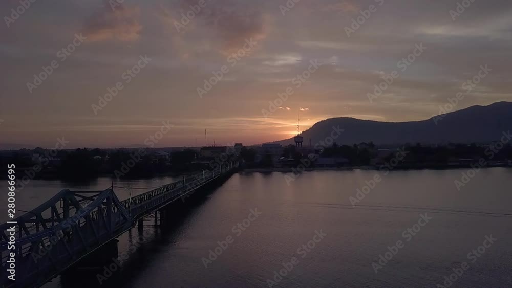 Aerial Shot of the Entanou Bridge and mountains on the Praek Tuek Chhu River in Kampot, Cambodia. Aerial Shot of the Entanou Bridge and mountains on the Praek Tuek Chhu River in Kampot, Cambodia.