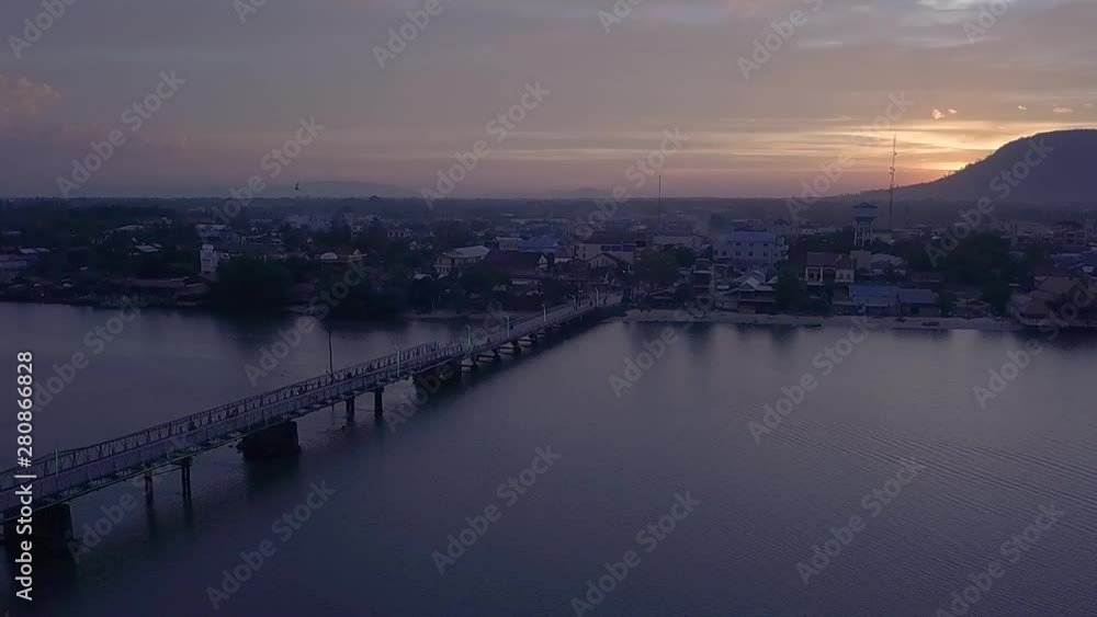 Aerial Shot of the Entanou Bridge and mountains on the Praek Tuek Chhu River in Kampot, Cambodia. Aerial Shot of the Entanou Bridge and mountains on the Praek Tuek Chhu River in Kampot, Cambodia.