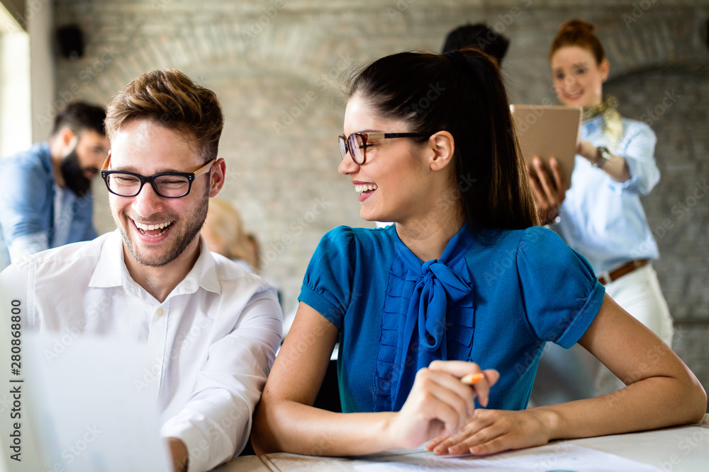 Group of young businesspeople or designers work with new startup project in office Group of young businesspeople or designers work with new startup project in office