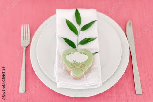 Wedding decor. Table for the newlyweds outdoor. Wedding reception. Elegant table arrangement, floral decoration, restaurant.