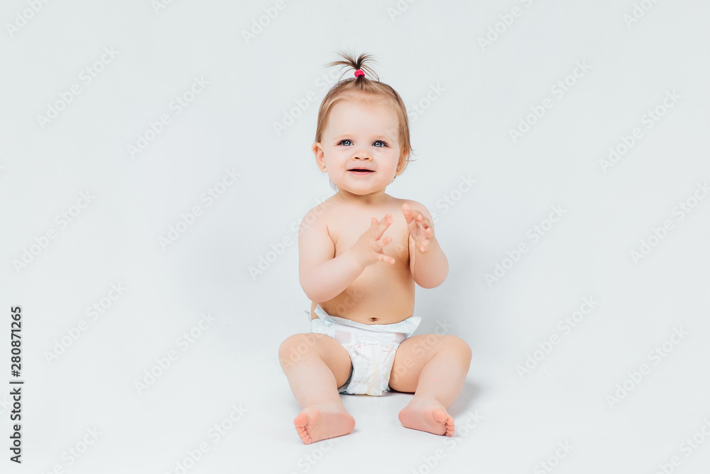 Infant child baby girl toddler crawling happy looking straight isolated on a white background. Infant child baby girl toddler crawling happy looking straight isolated on a white background.