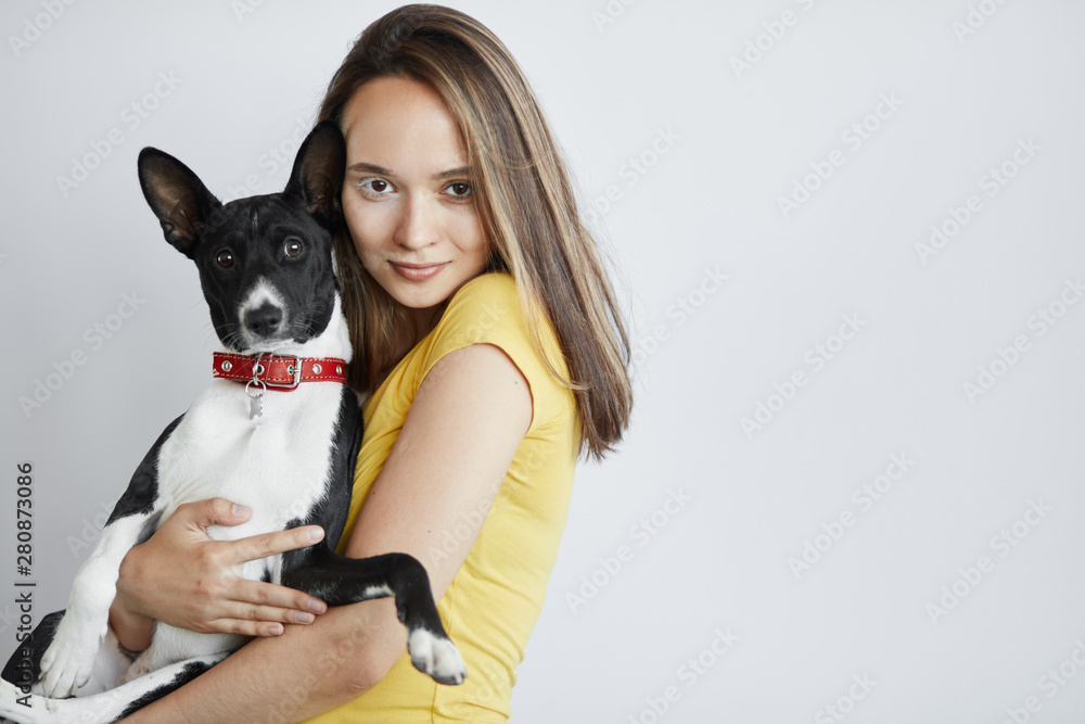 beautiful young woman hugging, embracing her dog. close up portrait. copy space. love concept.love at fist sight. support concept beautiful young woman hugging, embracing her dog. close up portrait. copy space. love concept.love at fist sight. support concept