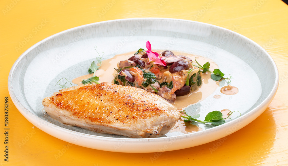 Fried chicken breast, with stewed spinach and grapes. Fried chicken breast, with stewed spinach and grapes.