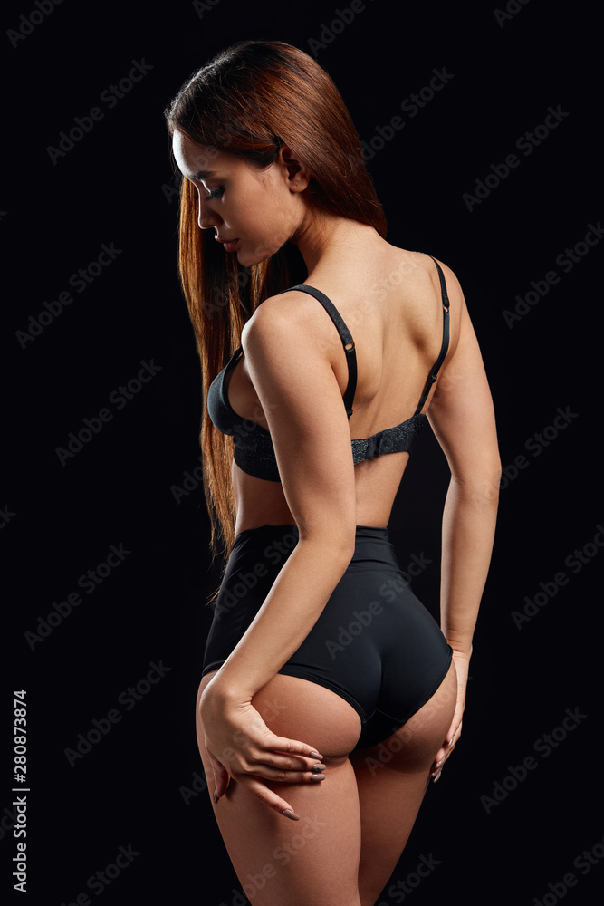 sad unhappy woman touching her sexy butt and looking down. close up photo.  studio shot foto de Stock | Adobe Stock