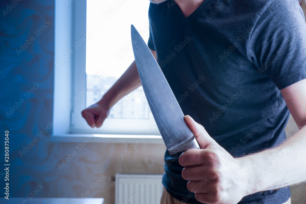 knife-wielding maniac. a crime of jealousy. a man threatens a kitchen knife at home