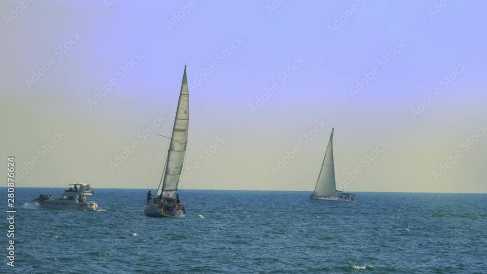 concept of water sports, summer fun. boats and sailing boats on the sea. concept of water sports, summer fun. boats and sailing boats on the sea.