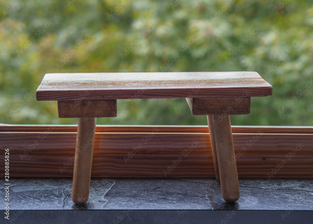 Fototapeta premium wooden bench over leaves