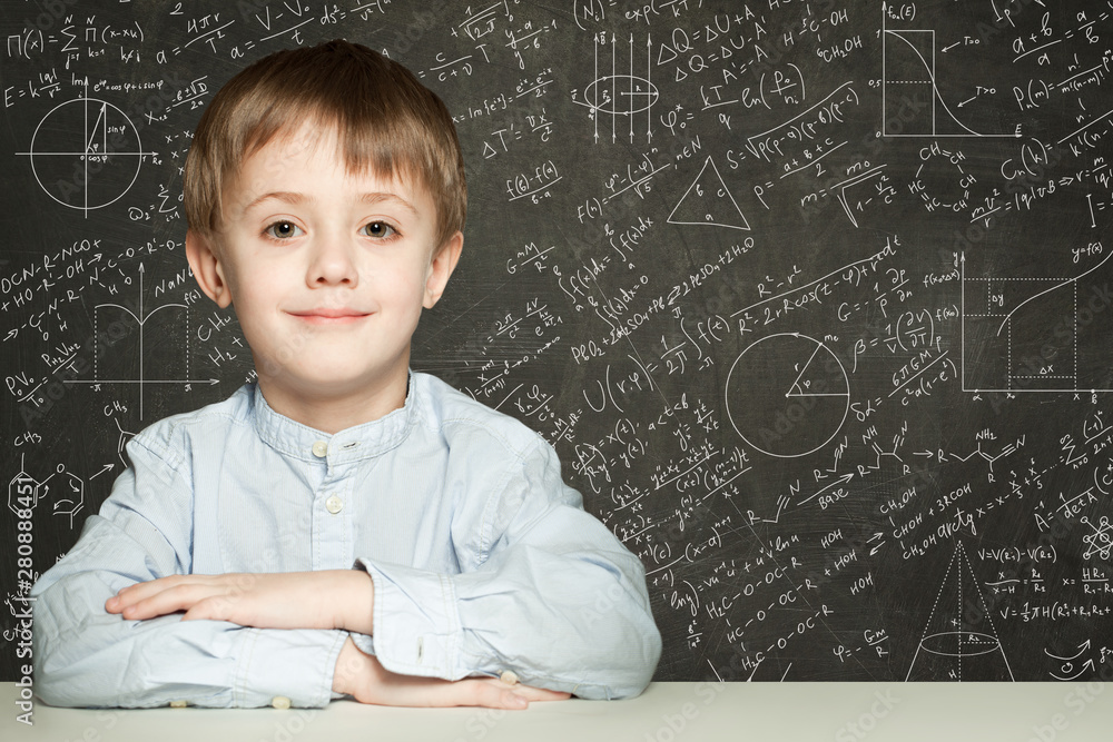 Cute smart child student on blackboard background with science f Cute smart child student on blackboard background with science f