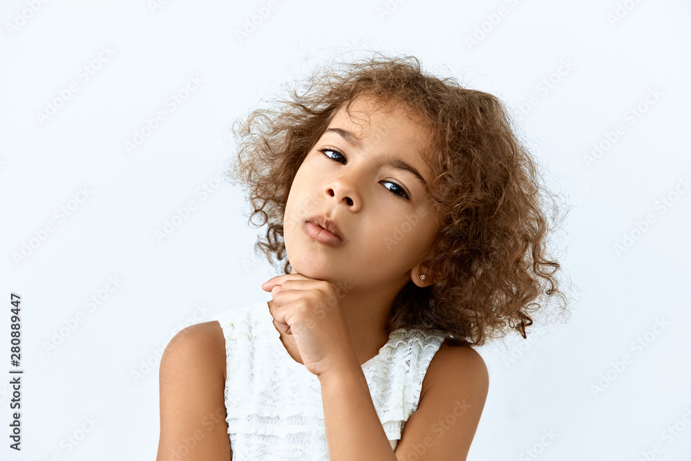 Thoughtful, thinking emotion concept. African American little girl face portrait on white backgound. Thoughtful, thinking emotion concept. African American little girl face portrait on white backgound.