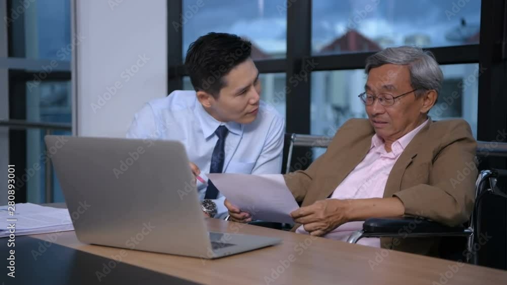 Business concept. People with disabilities are working with young men in the office. Business concept. People with disabilities are working with young men in the office.
