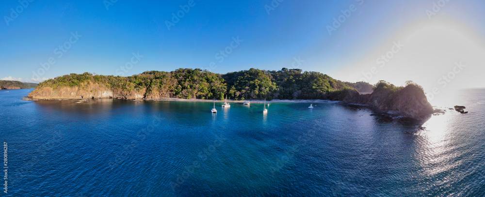 Panoramic View of a beach with Sailboats