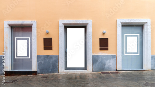 Three blank shop windows with two blank bronze signs in between for mockup