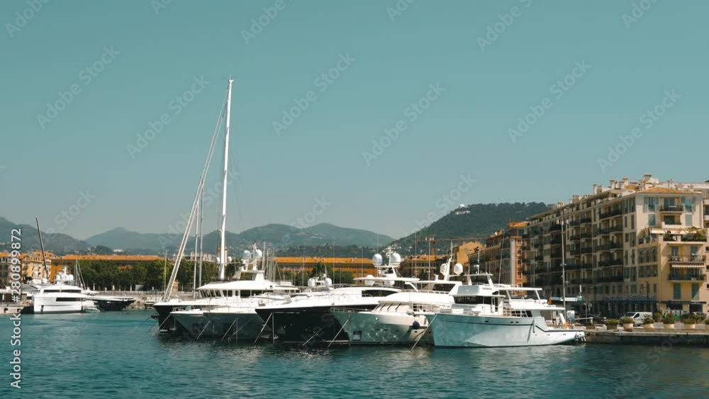Yachts, sunny panorama of Lagune in Nice. Port Lympia. Buildings for tourists. Yachts, sunny panorama of Lagune in Nice. Port Lympia. Buildings for tourists.